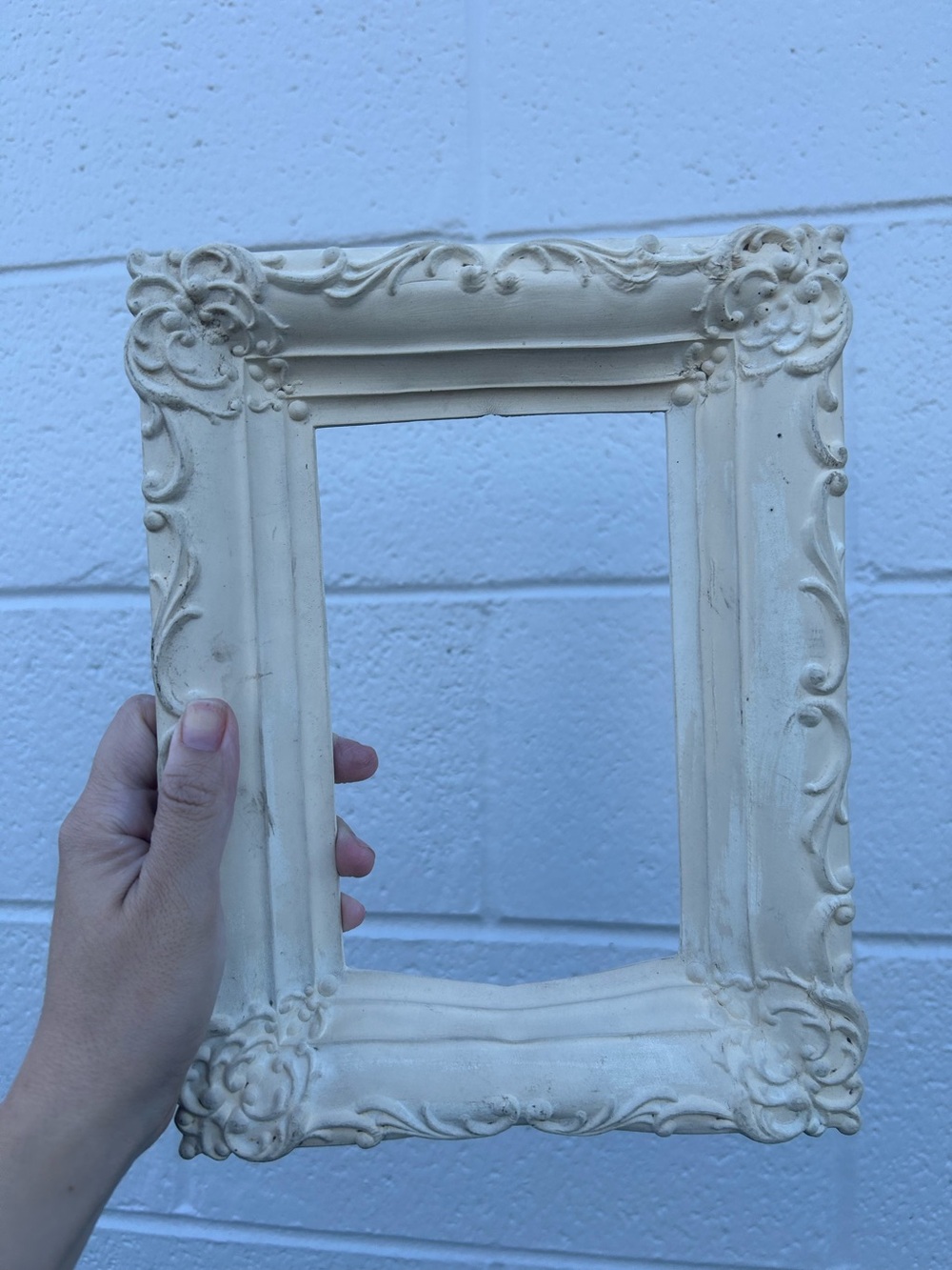 vintage ornate baroque picture frame in an off-white or cream shabby chic